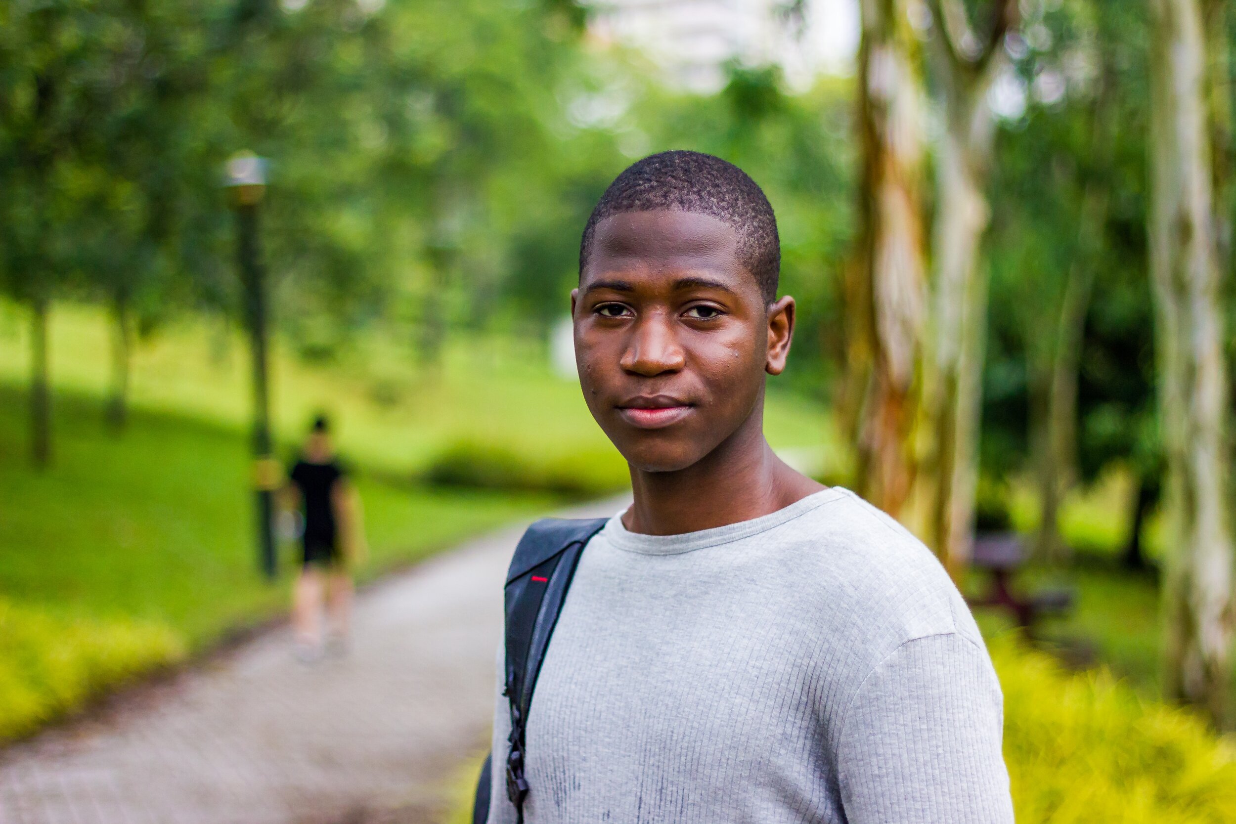 Man with backpack on a walking trail